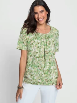 Blouse fluide à manches courtes et motifs floraux