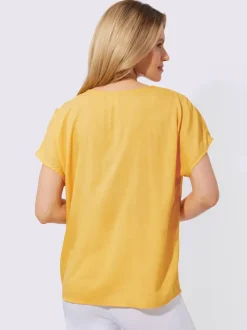 Chemisier doux et fluide avec col V et chaîne décorative