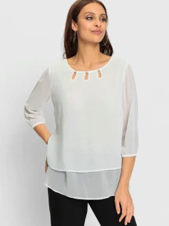 Chemisier en georgette fluide et légèrement transparent col rond