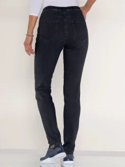 Jean femme coupe slim en denim stretch et poches arrière