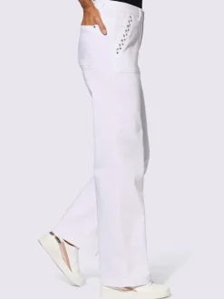 Jean à jambes larges en coton avec œillets et rivets décoratifs