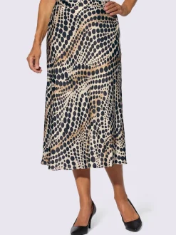 Jupe en satin à pois et ondulations et coupe évasée