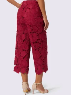 Pantalon en dentelle à motif floral et ourlet scallé