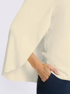 Pull en tricot fin poncho avec bas cousu