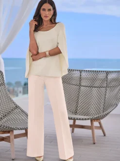 Pull en tricot fin poncho avec bas cousu