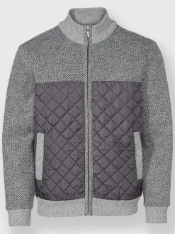 Veste en tricot avec empiècements matelassés